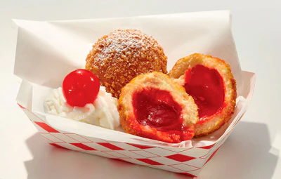 This undated photo provided by the State Fair of Texas shows Fried Jell-O, created by Ruth Hauntz. Eight funky foods, including Fried Jell-O, are in the running for Best Taste and Most Creative in the State Fair of Texas annual Big Tex Choice Awards. Fair officials in Dallas on Wednesday, Aug. 17, 2016, announced the eight finalists, with the two top picks to be revealed on Aug. 28. (State Fair of Texas via AP)