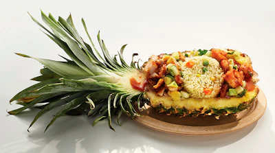 This undated photo provided by the State Fair of Texas shows Caribbean Pineapple Korn-a-Copia, created by Stephen Alade. Eight funky foods, including Caribbean Pineapple Korn-a-Copia, are in the running for Best Taste and Most Creative in the State Fair of Texas annual Big Tex Choice Awards. Fair officials in Dallas on Wednesday, Aug. 17, 2016, announced the eight finalists, with the two top picks to be revealed on Aug. 28. (State Fair of Texas via AP)