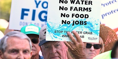 California farmers rally at the Capitol to protest a proposal by state water officials to increase water flows for the lower San Joaquin River to protect fish, at the Capitol, Monday, Aug. 20, 2018, in Sacramento, Calif. The State Water Resources Control Board is holding hearings this week concerning a plan to allow more water to flow freely down the Sacramento-San Joaquin River Delta from February to June, meaning less water will be available for farming and other needs. (AP Photo/Rich Pedroncelli)