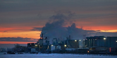FILE - In this Jan. 11, 2016 file photo, dawn approaches over the meat processing plant owned and run by Cargill Meat Solutions, in Fort Morgan, a small town on the eastern plains of Colorado. The U.S. Equal Employment Commission said Friday, Sept. 14, 2018 that Cargill has agreed to pay $1.5 million to 138 Somali-American Muslim workers who were fired from the plant in 2016 after they were refused prayer breaks. (AP Photo/Brennan Linsley, File)