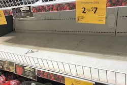 In this Sept. 14, 2018, photo, empty shelves, normally stocked with strawberry punnets, are seen at a Coles Supermarket in Brisbane. Public fears about sewing needles concealed inside strawberries on supermarket shelves have spread across Australia and New Zealand as growers turn to metal detectors and the Australian government launches an investigation to restore confidence in the popular fruit.(Dan Peled/AAP Image via AP)