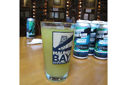 A glass of 'Alegae Bloom' beer at Maumee Bay Brewing Co. in Toledo, Ohio, on Wednesday, Sept. 12, 2018. The brewery is making the green, murky beer to draw attention to the algae blooms that taint Lake Erie's water. (AP Photo/John Seewer)