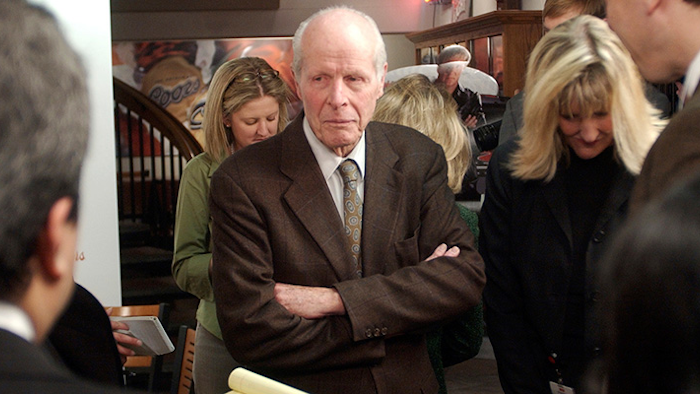FILE - In this Tuesday, Feb. 1, 2005, file photo, William 'Bill' Coors, center, talks about the merger between Molson and Coors after a news conference at the Coors Brewery in Golden, Colo. Molson Coors Brewing Co. said that William 'Bill' Coors, the former chairman of Adolph Coors Co. and grandson of the brewing company's founder, died Saturday, Oct. 13, 2018, at age 102. (AP Photo/Ed Andrieski, File)