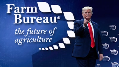 President Donald Trump walks on stage to speak at the American Farm Bureau Federation's convention in Austin, TX on Sunday, Jan. 19.