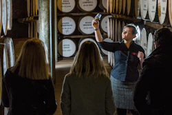 People are guided during a cellar tour of the Dewar’s Distillery in Aberfeldy, the Scottish Highlands, in 2018, where they have produced Scotch whisky since 1898, and offer traditional whisky tastings, and a whisky and chocolate tasting tour.