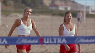 This undated image provided by Michelob ULTRA shows Kerri Walsh Jennings, left, and Brooke Sweat in a scene from the company's 2020 Super Bowl NFL football spot.