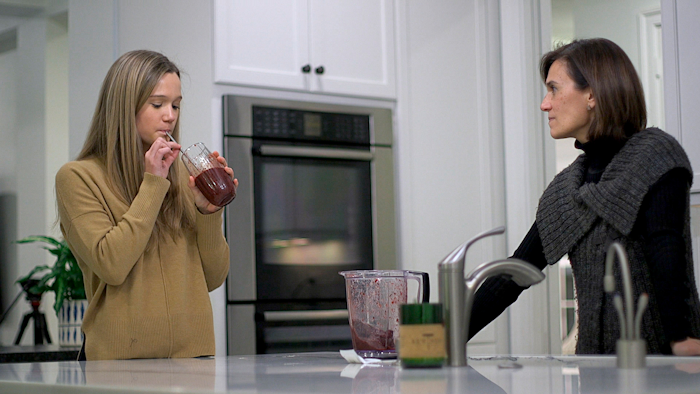 In this Jan. 10, 2020 image from video, 18-year-old Nina Nichols takes her daily dose of Palforzia as her mother, Maria Acebal watches, in her home in Washington. On Friday, Jan. 30, the Food and Drug Administration approved Palforzia, the first treatment for peanut allergies in a big step toward better care for all kinds of food allergies -- but still a long way from a cure.