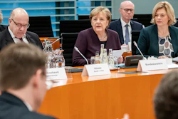 German Chancellor Angela Merkel, center, speaks alongside Peter Altmaier, Federal Minister of Economics and Energy, left, and Julia Klöckner, Federal Minister of Food and Agriculture, at the beginning of a meeting of the Federal Government with representatives of the food industry in Berlin, Germany on Monday, Feb.3.