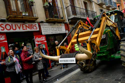 A farmer blocks the center of the city with his tractors during a protest in Pamplona, northern Spain on Wednesday, Feb. 19. Farmers across Spain are taking part in mass protests over what they say are plummeting incomes for agricultural workers.