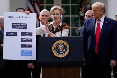 President Donald Trump listens as Dr. Deborah Birx, White House coronavirus response coordinator, speaks during a news conference about the coronavirus in the Rose Garden of the White House on Friday, March 13 in Washington.