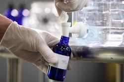 Logan Snyder bottles hand sanitizer made at the Eight Oaks Farm Distillery in New Tripoli, PA on Monday, March 16. The distillery's owner, Chad Butters, grew increasingly angry as he saw the skyrocketing price of hand sanitizer. So he's temporarily converting his operation into a production line for the suddenly hard-to-find, gooey, alcohol-based disinfectant.