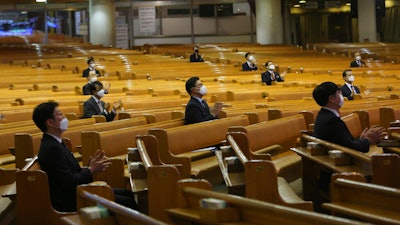 Pastors wearing face masks attend a service at the Yoido Full Gospel Church in Seoul, South Korea, March 15, 2020.