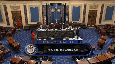 In this image from video, the final vote of 96-0 shows passage of the $2.2 trillion economic rescue package in response to coronavirus pandemic, passed by the Senate at the U.S. Capitol in Washington on Wednesday, March 25