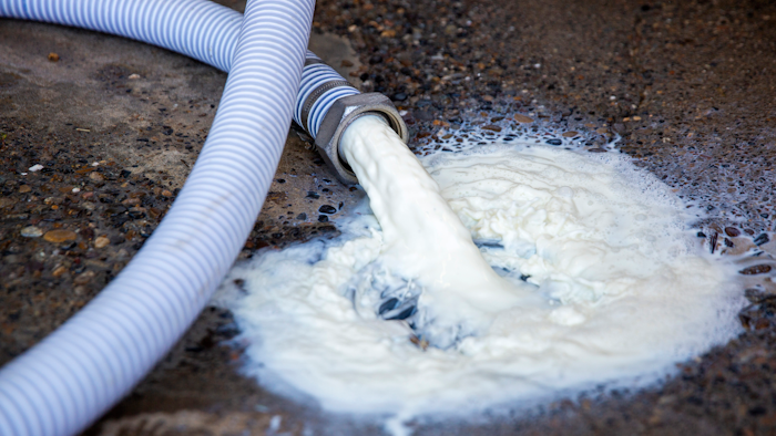 Milk pours out of the bulk tank and into the drain on Wednesday, April 8 at the Azevedo Family Dairy in Buhl, ID. With restaurants across the country closed, milk processors have lost a significant chunk of their market, leaving dairy farmers with no one to take their milk. Owner Richard Azevedo says 4,100 gallons of milk were dumped that morning. 'It's hard to watch that go down the drain,' he says.