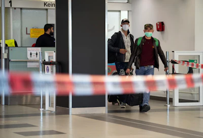 First people from Craiova in Romania arrive with their luggage and face masks at the 'Schoenefeld Airport' in Berlin, Germany on Thursday, April 9. The first planes with harvest workers from Romania have been landing in the morning.