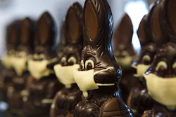 In this photo taken on Wednesday, April 8, chocolate rabbits with face masks are lined up at the Cocoatree chocolate shop in Lonzee, Belgium. As all non-essential shops in Belgium have been closed due to the outbreak of COVID-19, many chocolatiers have had to resort to online sales, home delivery or pick up on site.