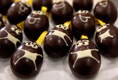 A tray of chocolate Easter eggs with face masks are laid out on a tray at the Chocolate Line warehouse of Dominique Persoone in Bruges, Belgium on Friday, April 10.