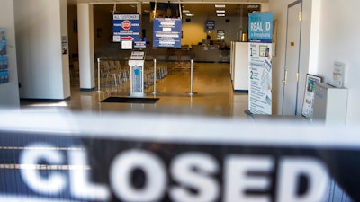 n this April 3, 2020, file photo, the seats and aisles are empty as seen through the window of the closed Penndot Drivers License Center in Butler, Pa. Small business owners hoping for quick loans from the government were in a holding pattern Monday, April 6, 2020, waiting on their bank to either take their application or, if it did, send them the money.