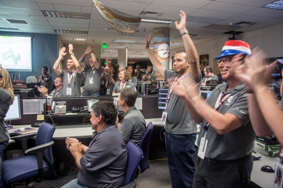 Engineers at Lockheed Martin celebrate after monitoring NASA&rsquo;s Juno spacecraft as it goes into orbit at Jupiter.