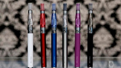 E-cigarettes appear on display at Vape store in Chicago. U.S. Sen. Charles Schumer is increasing the heat on the federal government to consider recalling e-cigarette batteries and devices that explode and catch fire, injuring users.