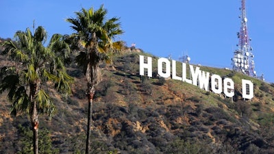 In this Sunday, Jan. 1, 2017, file photo, the Hollywood sign is seen vandalized. Los Angeles residents awoke New Year's Day to find a prankster had altered the famed Hollywood sign to read 'HOLLYWeeD.' Police have also notified the city's Department of General Services, whose officers patrol Griffith Park and the area of the rugged Hollywood Hills near the sign. California voters in November approved Proposition 64, which legalized the recreational use of marijuana, beginning in 2018.
