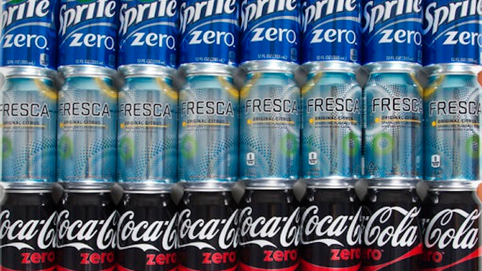In this Friday, April 21, 2017, photo, cans of Coca-Cola products are arranged for a photo in Surfside, Fla. On Tuesday, April 25, 2017, The Coca-Cola Company reports earnings.