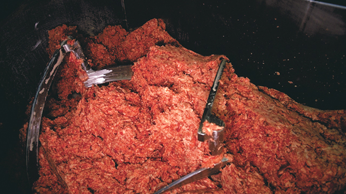 Ground beef, pictured in a food processing plant.