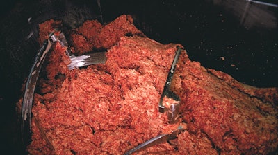 Ground beef, pictured in a food processing plant.