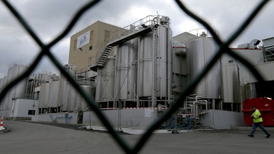 This Monday Dec. 11, 2017 file picture shows a general view of the Lactalis plant and milk production site where possible source of the outbreak has been identified in Craon, western France. A tainted baby milk scandal affecting some 30 countries is growing, as French dairy giant Lactalis recalled millions more products globally because of salmonella contamination.