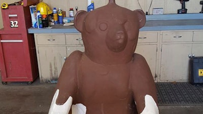 This Dec. 13, 2017 photo provided by the Abilene, Kan., Police Department shows a bear statue at the department that was stolen from outside a candy factory in central Kansas a year ago. Abilene Police Department assistant chief Jason Wilkins says the Russell Stover Candies sculpture, depicting a sitting teddy bear covered in chocolate, was found Wednesday, Dec. 13, 2017 in a Salina home following a tip from someone apparently unconnected to its theft.