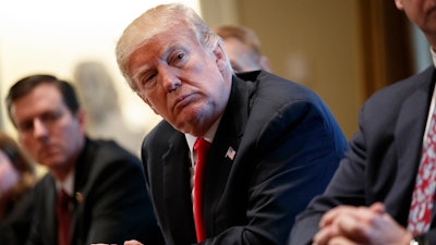 President Donald Trump listens during a meeting with steel and aluminum executives in the Cabinet Room of the White House, Thursday, March 1, 2018, in Washington. Trump's announcement that he will impose stiff tariffs on imported steel and aluminum has upended political alliances on Capitol Hill.