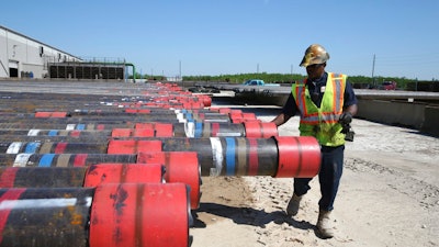 1 2 3 4 5 6 7 8 0 1 2 3 4 5 6 7 Taurice Jones inspects steel pipes as part of quality control at the Borusan Mannesmann plant in Baytown, Texas, Monday, April 23, 2018. President Donald Trump's escalating dispute with China over trade and technology is threatening jobs and profits in working-class communities where his 'America First' agenda hit home. Without a waiver, Borusan Mannesmann Pipe may face tariffs of $25 million to $30 million annually if it imports steel tubing and casing from its parent company in Turkey, according to information the company provided to The Associated Press.
