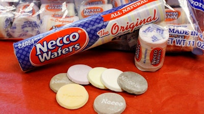 In this Oct. 14, 2009 file photo, Necco Wafers are displayed in Boston. Four bidders are vying to buy New England Confectionery Company, of Revere, Mass., the bankrupt manufacturer of Necco Wafers, Sweethearts and other iconic candies. A bankruptcy auction is scheduled for Wednesday, May 23, 2018. Necco said in March is will close and lay off hundreds of workers if a buyer isn't found. The company traces its roots to 1847 and calls itself the nation's oldest continuously operating candy company.