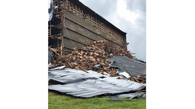 In this image provided by the Bardstown, Ky., Fire Department, debris is piled in a heap after a section of a bourbon storage warehouse at the Barton 1792 Distillery collapsed, Friday June 22, 2018, in Bardstown, Ky. Nelson County Emergency Management spokesman Milt Spalding says about 9,000 barrels filled with aging bourbon were affected.