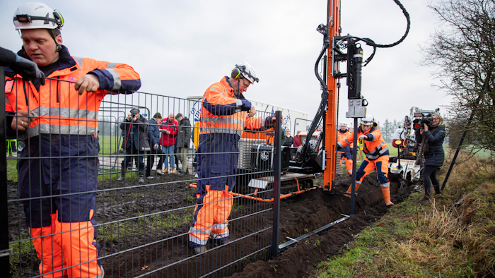 Workers erect a fence along the Denmark Germany border. Denmark has begun erecting a fence along the German border to keep out wild boars in an attempt to prevent the spread of African swine fever.