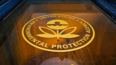 In this Sept. 21, 2017, file photo, a sign on a door of the Environmental Protection Agency in Washington. Government figures show the EPA has hit a 30-year low in the number of pollution cases referred for criminal prosecution. Justice Department data released Tuesday, Jan. 15, 2019, by the Public Employees for Environmental Responsibility show the EPA referred 166 cases for federal prosecution in fiscal year 2018.