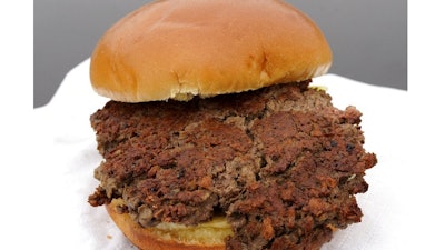 This Friday, Jan. 11, 2019 photo shows a plant-based burger made from wheat protein, coconut oil, potato protein and other ingredients in Bellevue, Neb. Released on Wednesday, Jan. 16, 2019, a report from a panel of nutrition, agriculture and environmental experts recommends a plant-based diet, based on previously published studies that have linked red meat to increased risk of health problems.