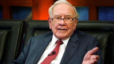 In this May 7, 2018, file photo Berkshire Hathaway Chairman and CEO Warren Buffett speaks during an interview in Omaha, Neb., with Liz Claman on Fox Business Network's 'Countdown to the Closing Bell.' Buffett said Greg Abel and Ajit Jain, the two potential successors he named, earned roughly $18 million last year managing Berkshire Hathaway’s dozens of operating companies. Buffett appeared on CNBC Monday, Feb. 25, 2019, after releasing his annual letter to Berkshire shareholders over the weekend. He reiterated Monday that Abel and Jain have both done a great job since they joined Berkshire’s board last January.