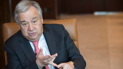 United Nations Secretary-General Antonio Guterres is photographed during an interview at United Nations headquarters on Tuesday, May 7, 2019. Guterres said the world has to change, not in small incremental ways but in big “transformative” ways into a green economy with electric vehicles and “clean cities” because the alternative “would mean a catastrophic situation for the whole world.”