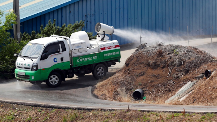 In this June 3, 2019, photo, Health officials spray disinfectant solution as a precaution against African swine fever near a pig farm in Incheon, South Korea. South Korea is concerned North Korea is ignoring its calls for joint efforts to stem the spread of highly contagious African swine fever following an outbreak in North Korea.