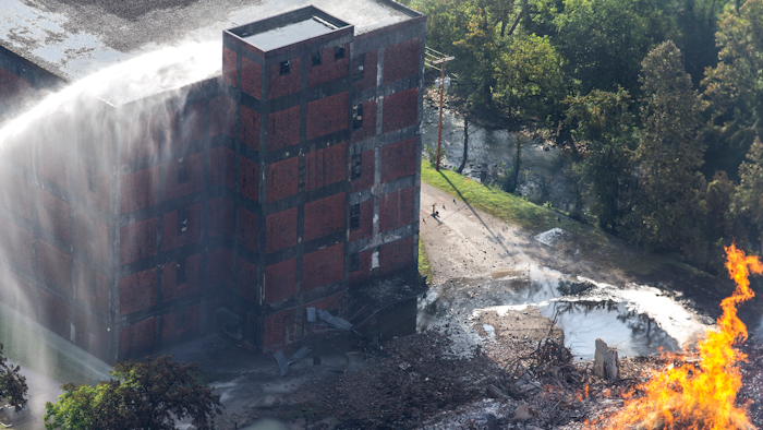 Flames and smoke rise from a bourbon warehouse fire at a Jim Beam distillery in Woodford County, KY.