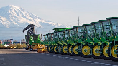 In this Nov. 4, 2019, file photo John Deere tractors made by Deere & Company are shown as they are readied for export to Asia at the Port of Tacoma in Tacoma, WA Deere & Co. reports earns on Wednesday, Nov. 27.