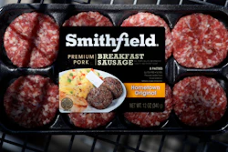 In this April 14 photo, a package of Smithfield Foods breakfast sausage sits in a shopping cart outside of a local grocery story, in Des Moines, IA.
