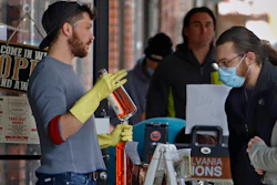 In this April 16 photo, people line up to purchase Pennsylvania made liquor at Pennsylvania Libations in Pittsburgh's Strip District. The Pennsylvania liquor control board closed the Pennsylvania state-owned stores that retail nearly all of Pennsylvania's liquor in March, driving up demand from the state's distilleries, which have been allowed to continue production and sales, although some report stockpiles are rapidly drying up.