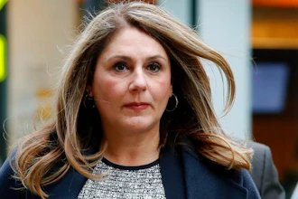 In this Feb. 25, 2020, file photo, Michelle Janavs arrives at federal court in Boston for sentencing in a nationwide college admissions bribery scandal. Lawyers for Janavs, who is supposed to report to prison in May, said in a legal filing Wednesday, April 22, 2020, that she should spend five months in home confinement instead of prison because she has an underlying health condition that makes her particularly vulnerable if she were to contract the coronavirus.