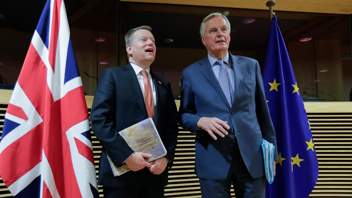 In this Monday, March 2 file photo, European Commission's Head of Task Force for Relations with the United Kingdom Michel Barnier, right, speaks with the British Prime Minister's Europe adviser David Frost during the start of the first round of post -Brexit trade talks between the EU and the UK, at EU headquarters in Brussels. Slowed by the coronavirus pandemic and whipped up by a British-imposed deadline, talks between the EU and the UK on a future relationship in the wake of Brexit are struggling to make significant progress.