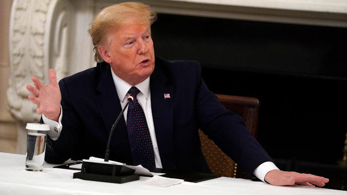 President Donald Trump speaks during a meeting with restaurant industry executives about the coronavirus response, in the State Dining Room of the White House on Monday, May 18.