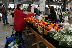 Carrie Simpson shops at the Detroit Farmers Market on Saturday, May 2 in Detroit.