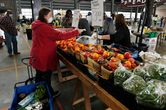 Carrie Simpson shops at the Detroit Farmers Market on Saturday, May 2 in Detroit.