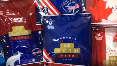 In this May 14, 2019, file photo, frozen beef filets from Australia, United States, and Canada are on sale at a supermarket in Beijing.
